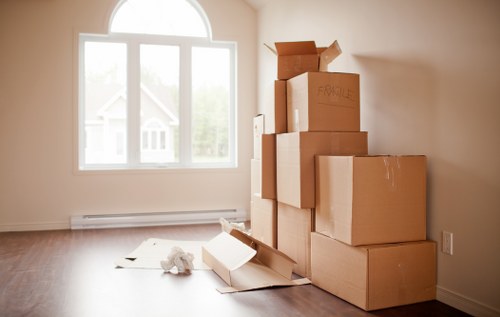 Professional movers carrying furniture in a local residential street