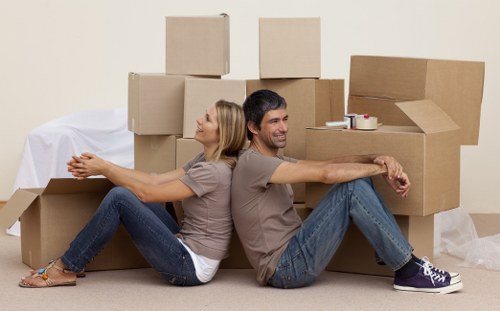 Careful loading of household items into a moving van in Croftonpark