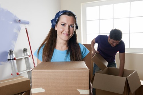 Worker reviewing safety steps before loading in a moving service