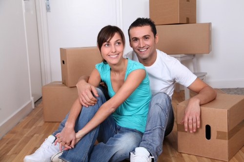 Loading household furniture into a moving van in Crofton Park