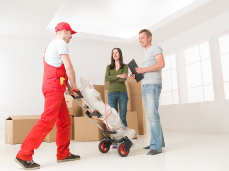 Careful loading of household items in a Croftonpark removal service