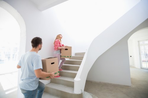 Furniture and boxes being loaded for a local van service