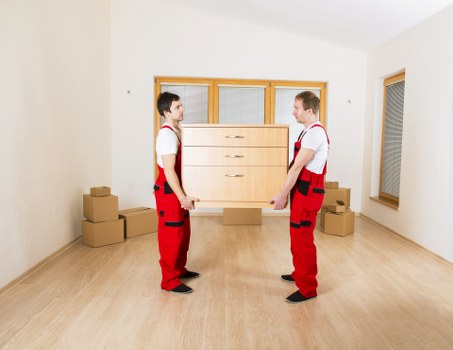 Office furniture and equipment being prepared for commercial relocation
